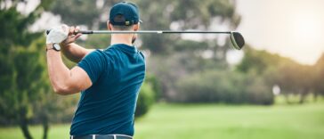 Sports, golf and man swing driver on field for exercise, training or workout match. Fitness, golfin