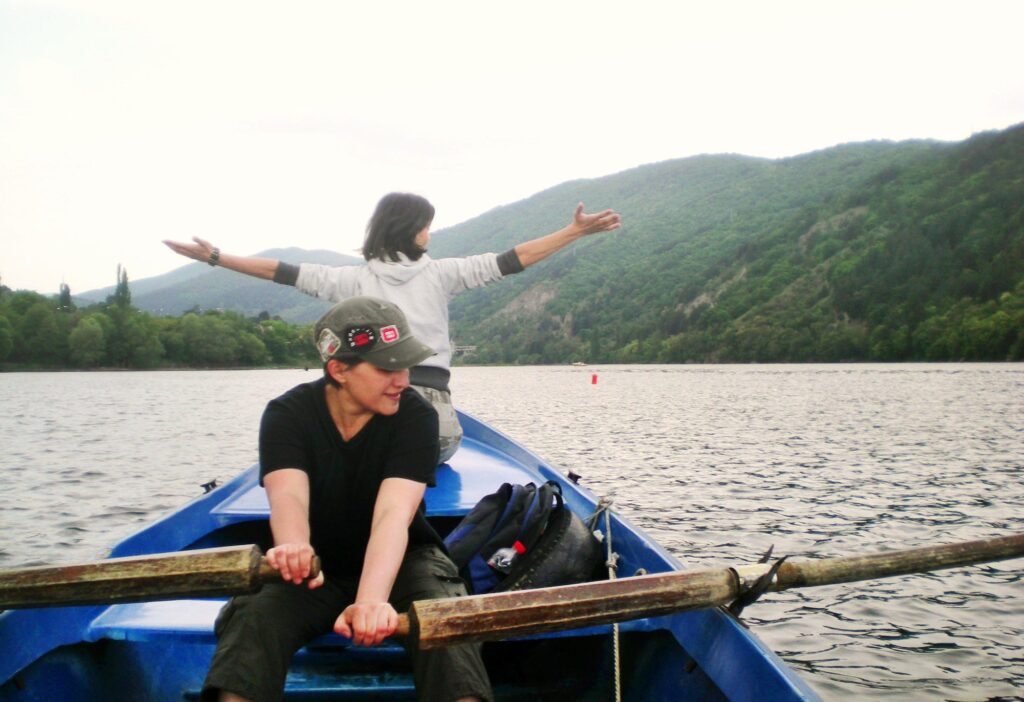 Women rowing a boat in a lake
